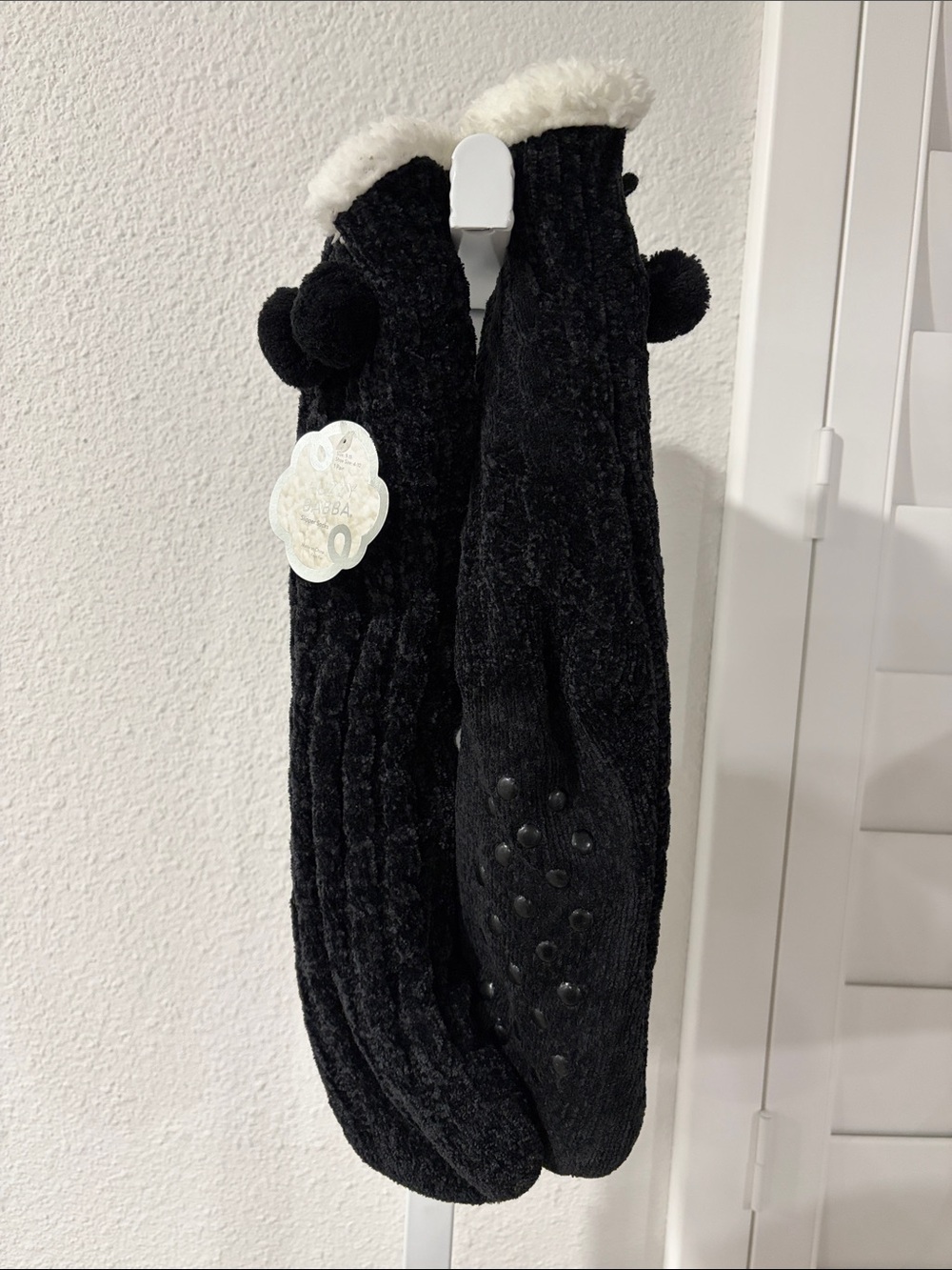 Francesca's Collections Womenโs Black Fleece-Lined Socks with Pom Poms and Grips